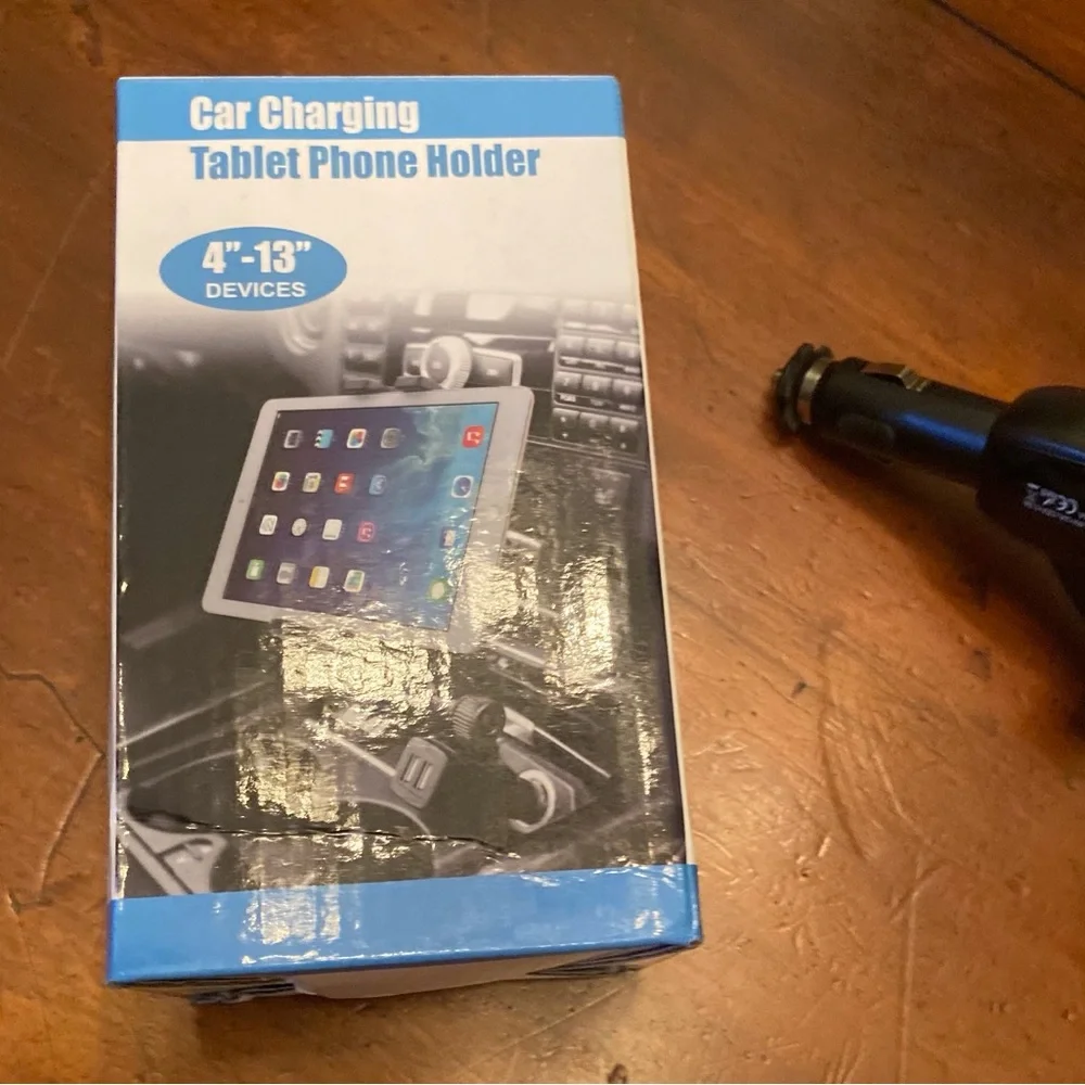 Car charging holder for tablet or phone, 2 usb ports, straps to hold device